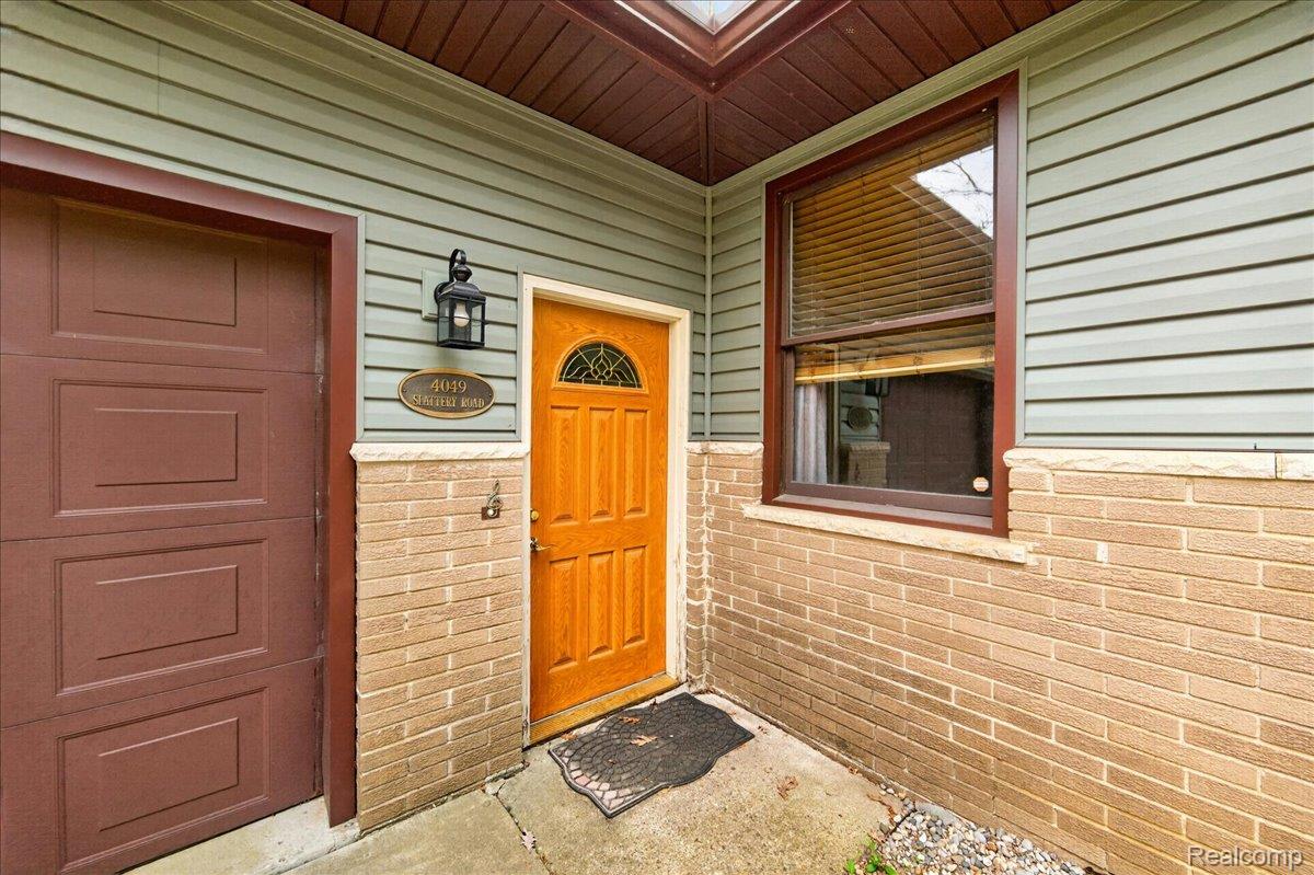 4049 Slattery Road North Branch, MI 48461 - Photo 5 of 45 Entrance to property featuring brick siding