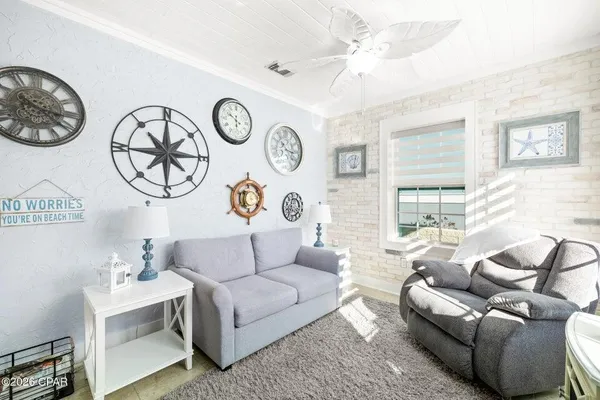 a living room with furniture and a large window