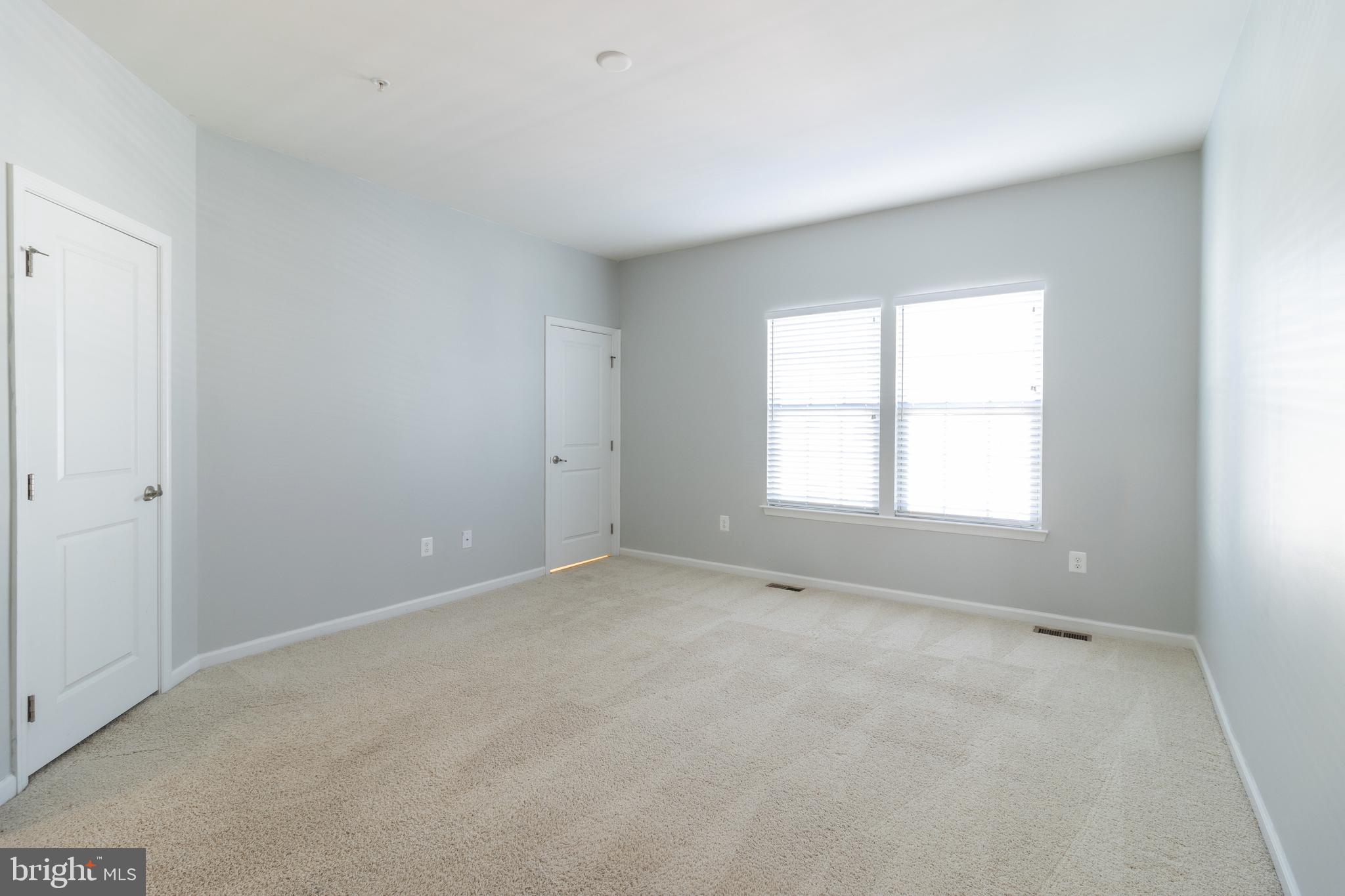 1044 Ramble Run Road Baltimore, MD 21220 - Photo 21 of 37 an empty room with a window