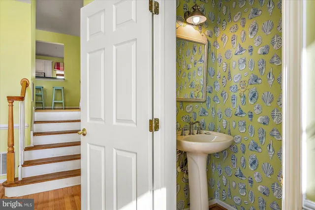 a kitchen with stainless steel appliances granite countertop a sink refrigerator and microwave