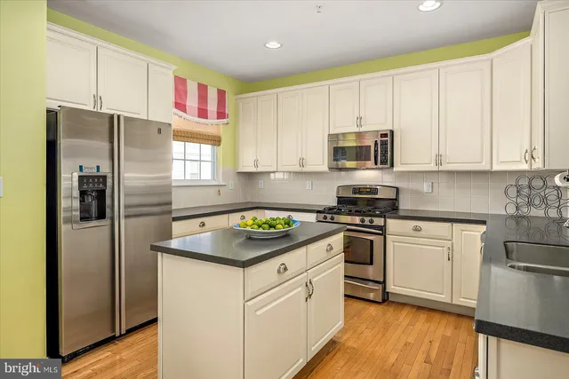 a bedroom with a bed dresser and a window