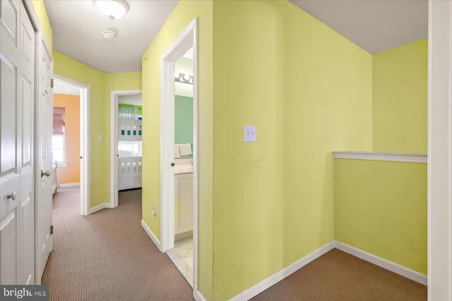 a kitchen with stainless steel appliances granite countertop a sink counter space cabinets and a large window