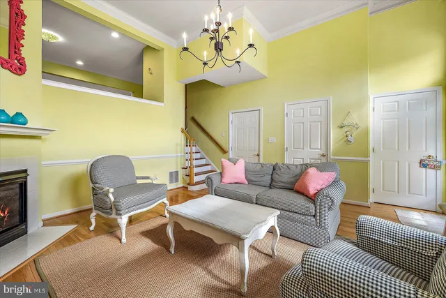 a living room with furniture a rug and a flat screen tv