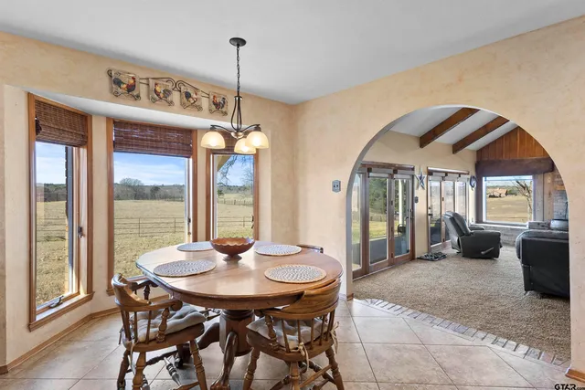 a kitchen with stainless steel appliances granite countertop a refrigerator and a stove