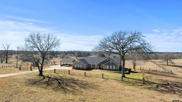 a view of a swimming pool with chair and table
