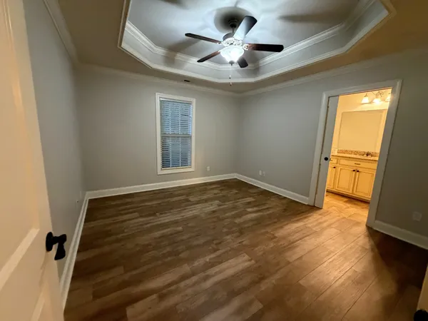 a kitchen with granite countertop a refrigerator sink and microwave