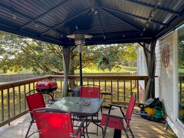 a view of an outdoor sitting area with furniture