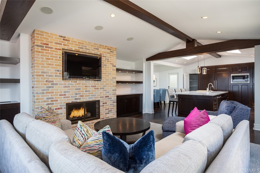 a living room with furniture or flat screen tv and a fireplace