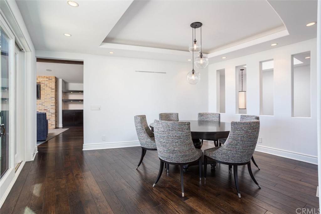841 Emerald Bay Laguna Beach, CA 92651 - Photo 12 of 31 a view of a dining room with furniture window and wooden floor