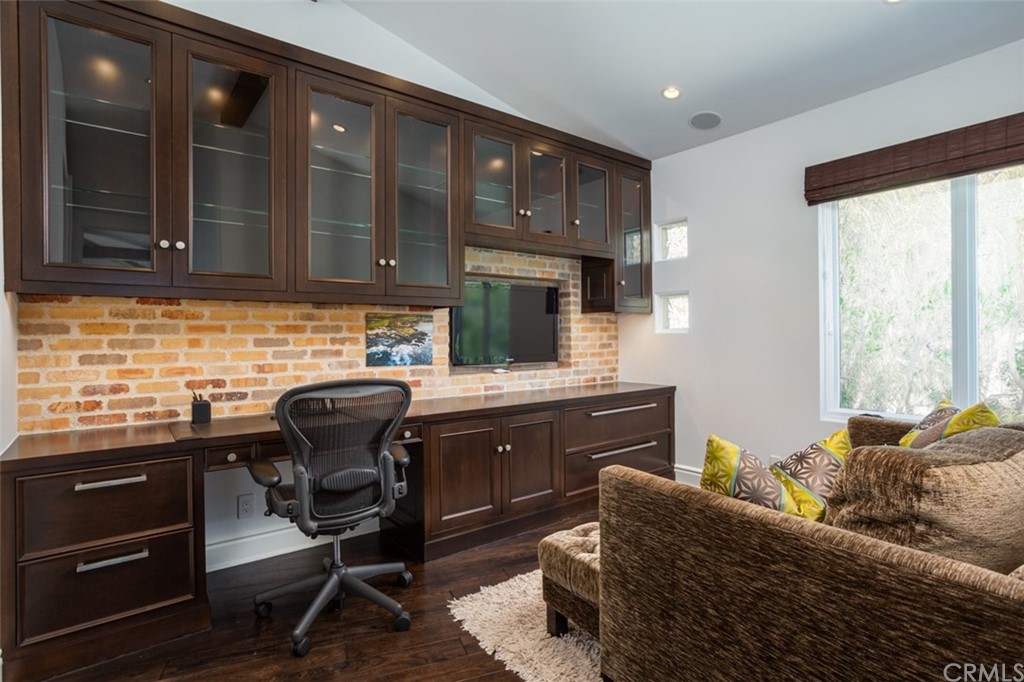 841 Emerald Bay Laguna Beach, CA 92651 - Photo 13 of 31 a kitchen with granite countertop a sink cabinets and appliances