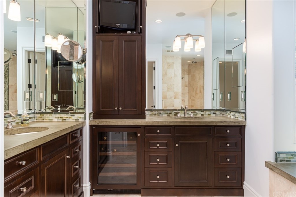 841 Emerald Bay Laguna Beach, CA 92651 - Photo 17 of 31 a bathroom with a sink and a mirror