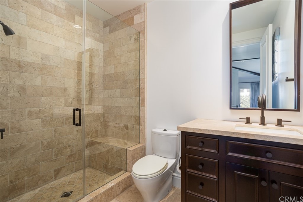 841 Emerald Bay Laguna Beach, CA 92651 - Photo 23 of 31 a bathroom with a sink toilet and shower