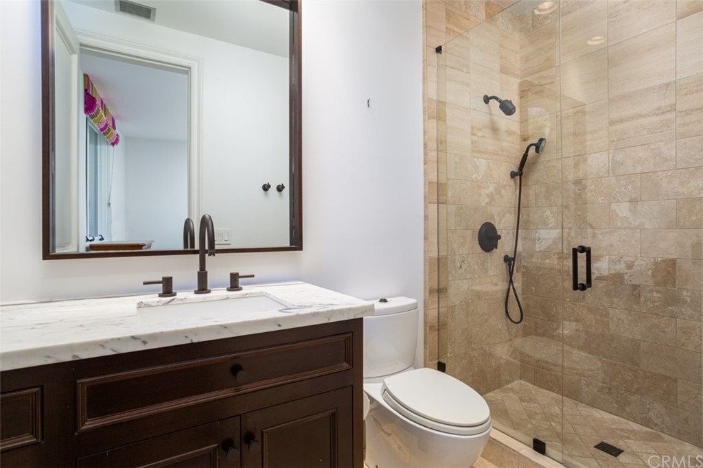 841 Emerald Bay Laguna Beach, CA 92651 - Photo 30 of 31 a bathroom with a sink a toilet and shower