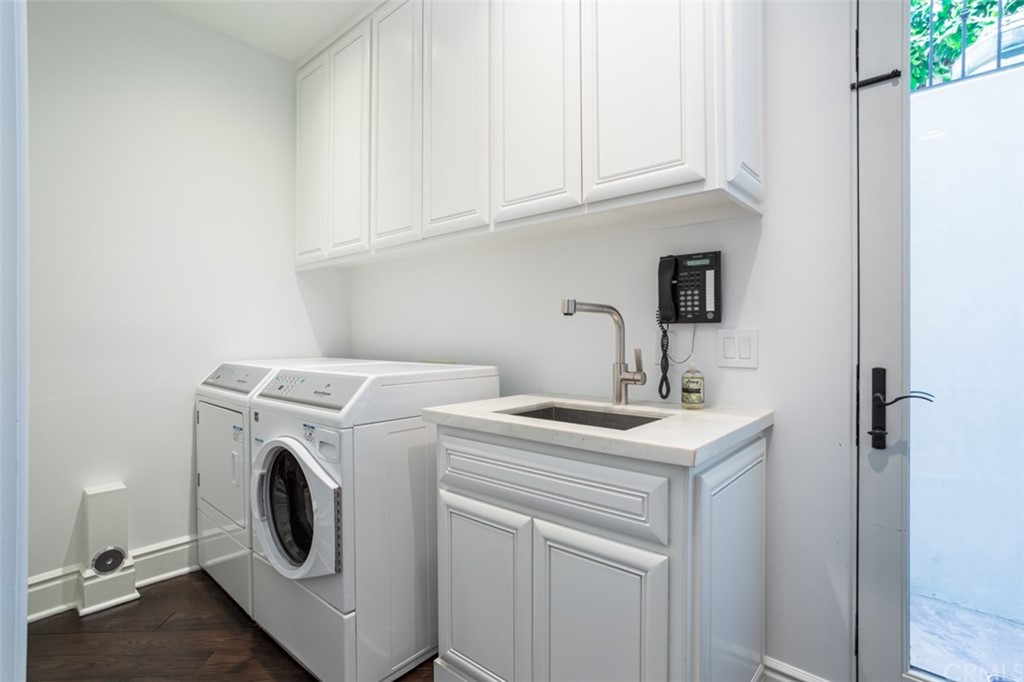 841 Emerald Bay Laguna Beach, CA 92651 - Photo 31 of 31 a utility room with dryer and washer