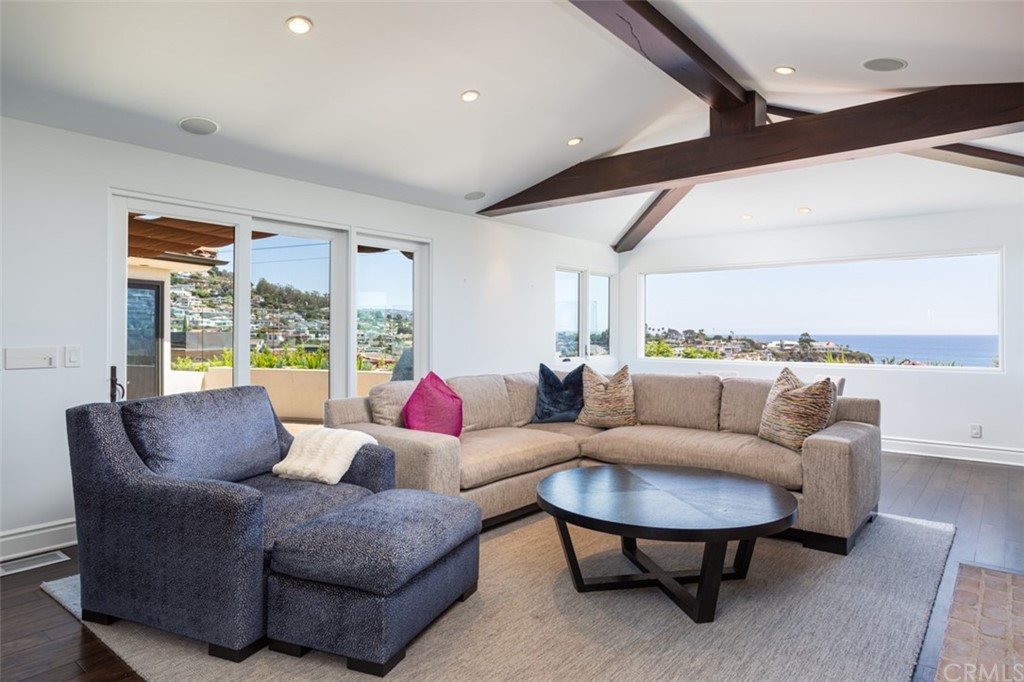 841 Emerald Bay Laguna Beach, CA 92651 - Photo 7 of 31 a living room with furniture and a large window