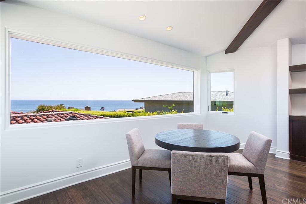 841 Emerald Bay Laguna Beach, CA 92651 - Photo 9 of 31 a view of a dining room with furniture and a window