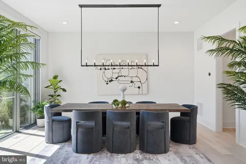 a kitchen with stainless steel appliances granite countertop a stove a sink a refrigerator and island