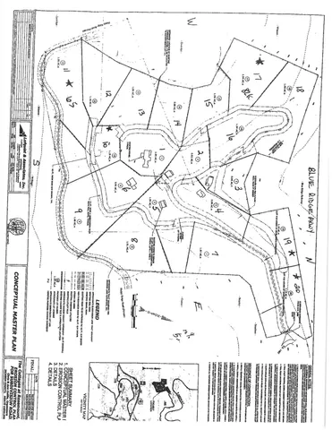 wooden floor with a white comforter and pillows