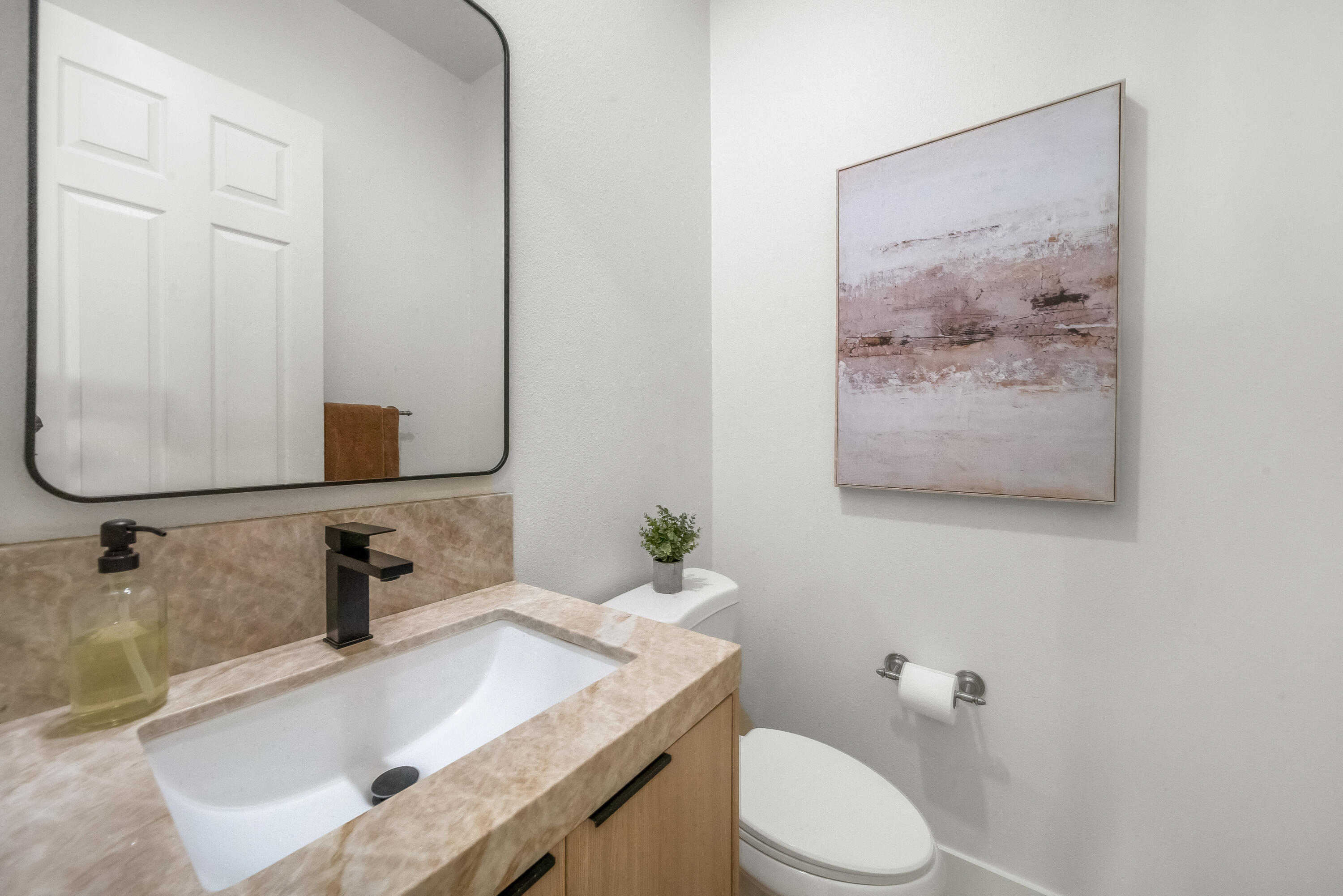 80262 Amazon Avenue Indio, CA 92201 - Photo 30 of 69 a bathroom with a granite countertop sink mirror and toilet