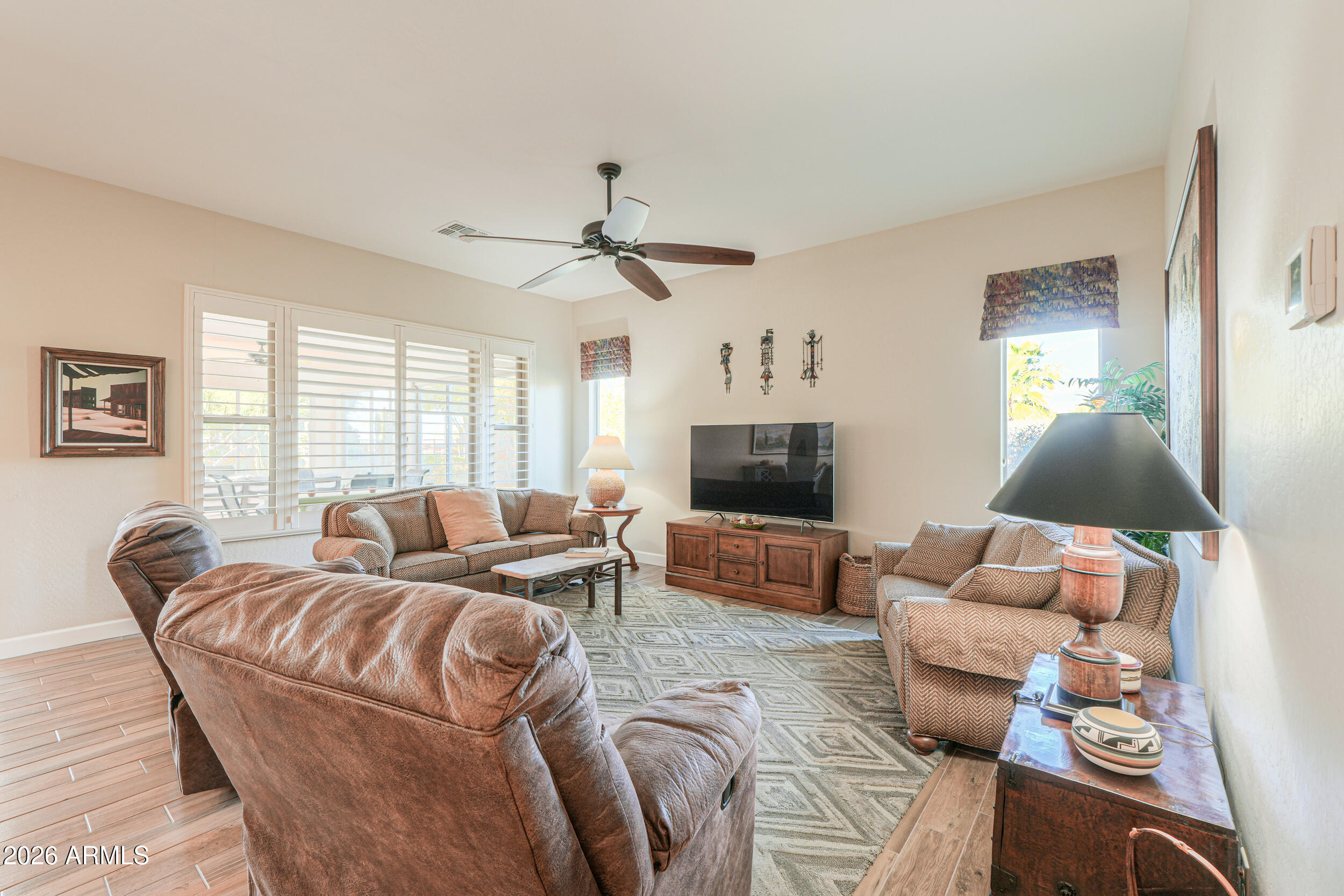 5048 North Scottsdale Road Eloy, AZ 85131 - Photo 16 of 53 a living room with furniture and a flat screen tv