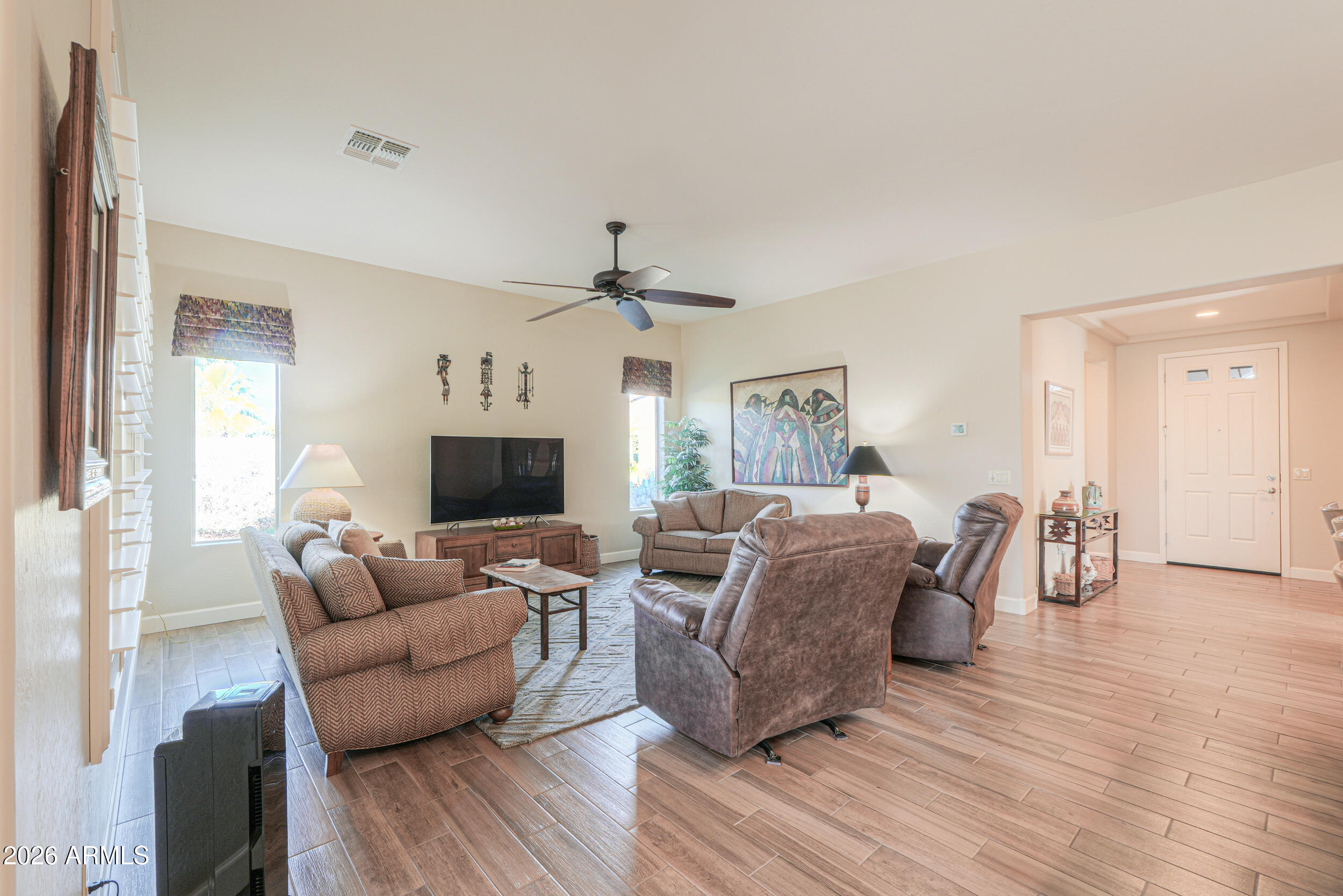 5048 North Scottsdale Road Eloy, AZ 85131 - Photo 17 of 53 a living room with furniture and a flat screen tv