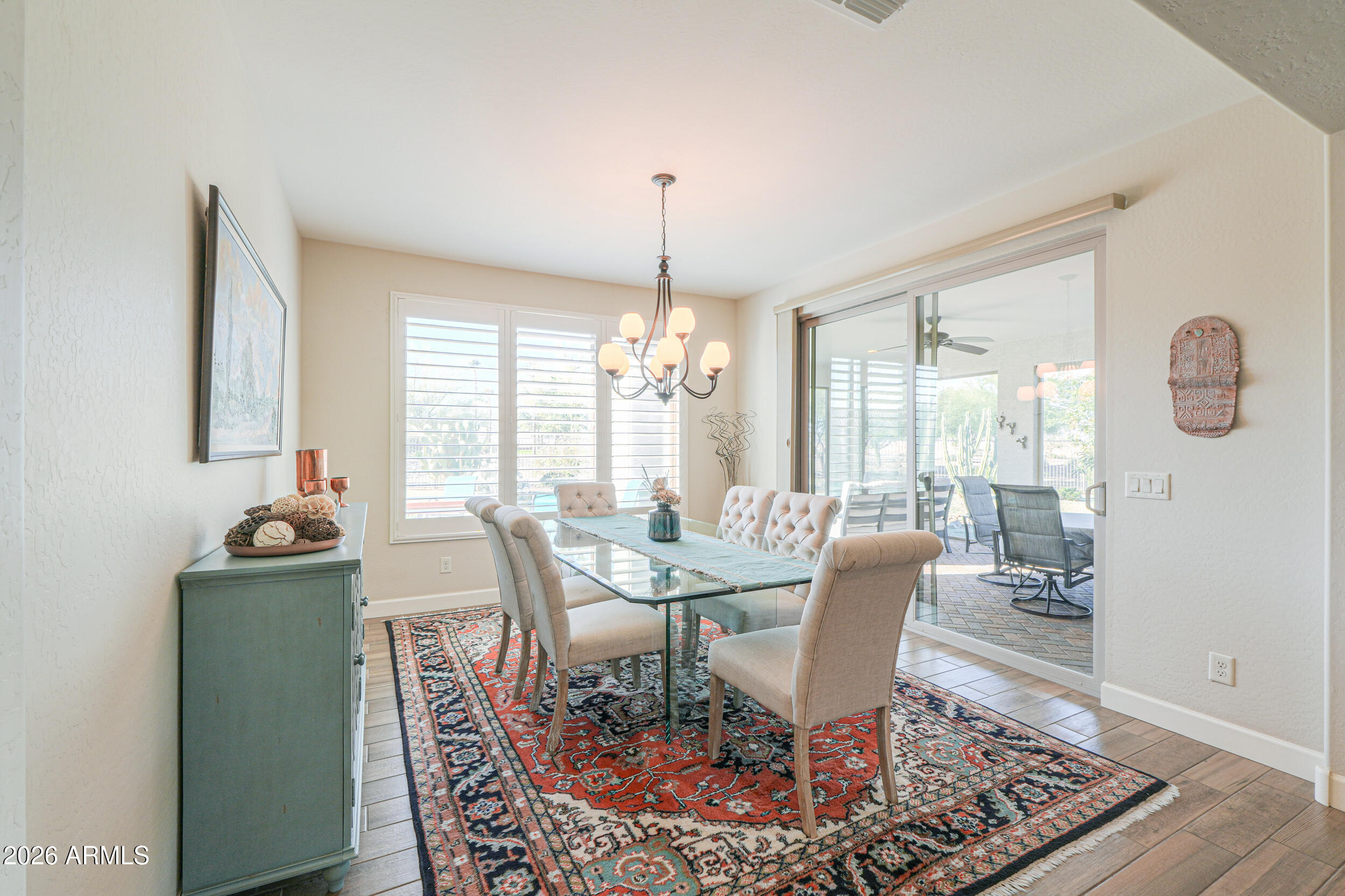 5048 North Scottsdale Road Eloy, AZ 85131 - Photo 19 of 53 a dining room with furniture window and wooden floor