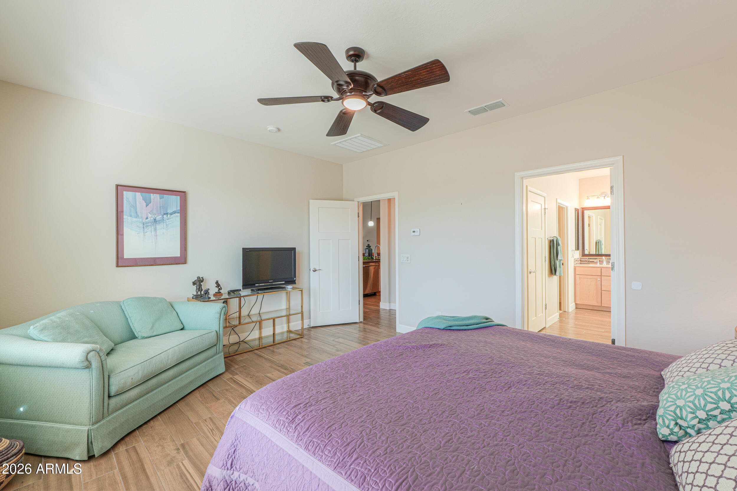 5048 North Scottsdale Road Eloy, AZ 85131 - Photo 22 of 53 a bedroom with a couch ceiling fan and a window