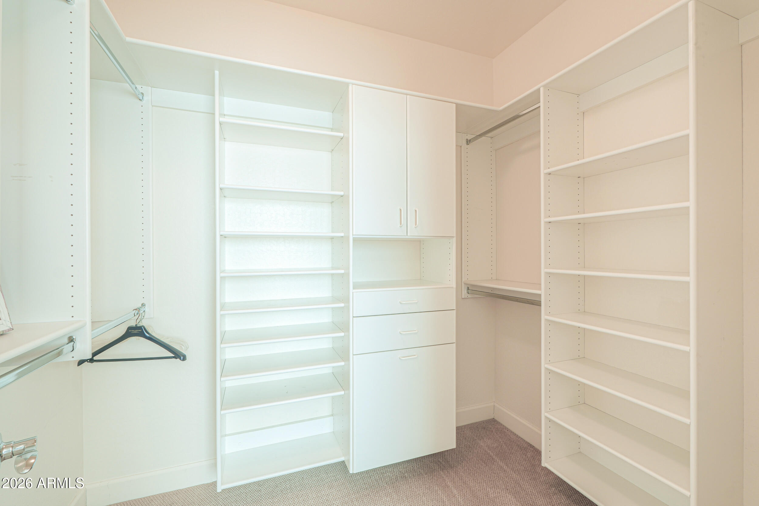 5048 North Scottsdale Road Eloy, AZ 85131 - Photo 25 of 53 a view of walk in closet with empty racks