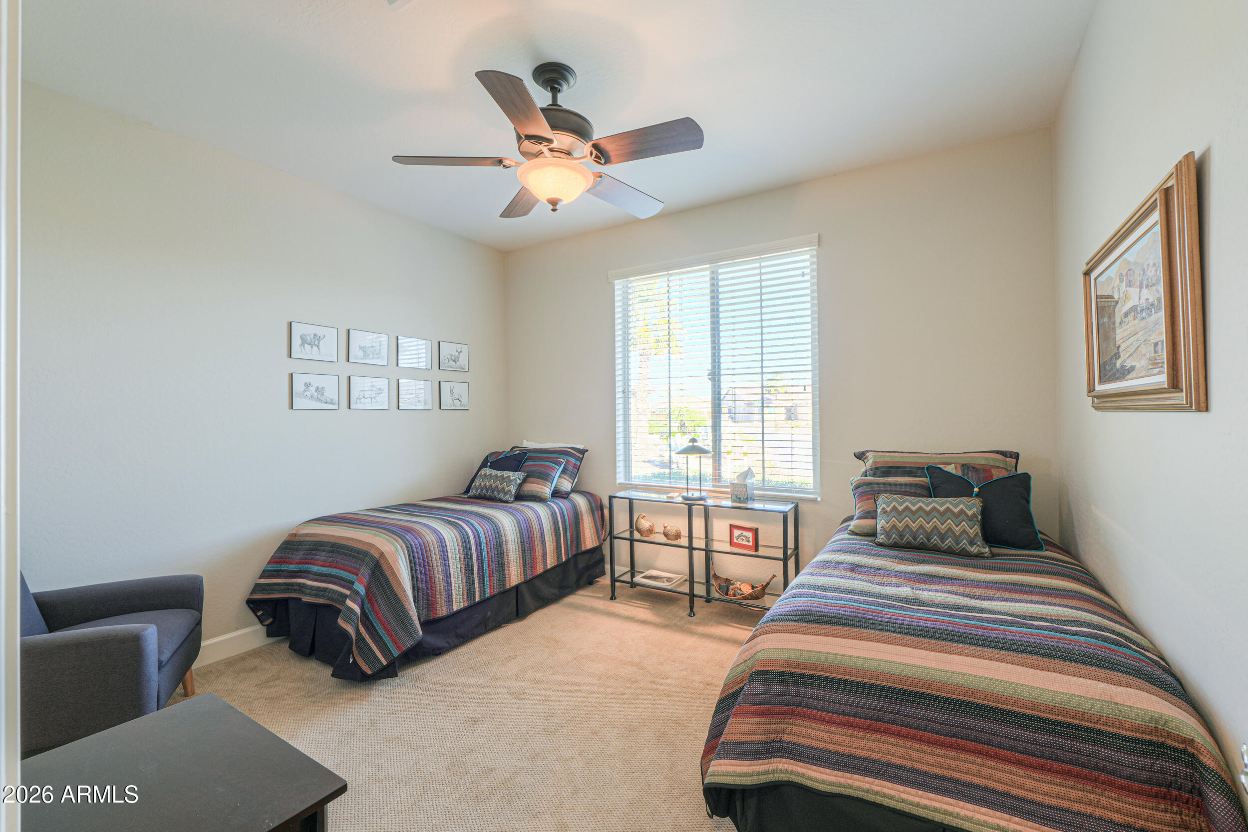5048 North Scottsdale Road Eloy, AZ 85131 - Photo 26 of 53 a bedroom with two beds and painting on the wall