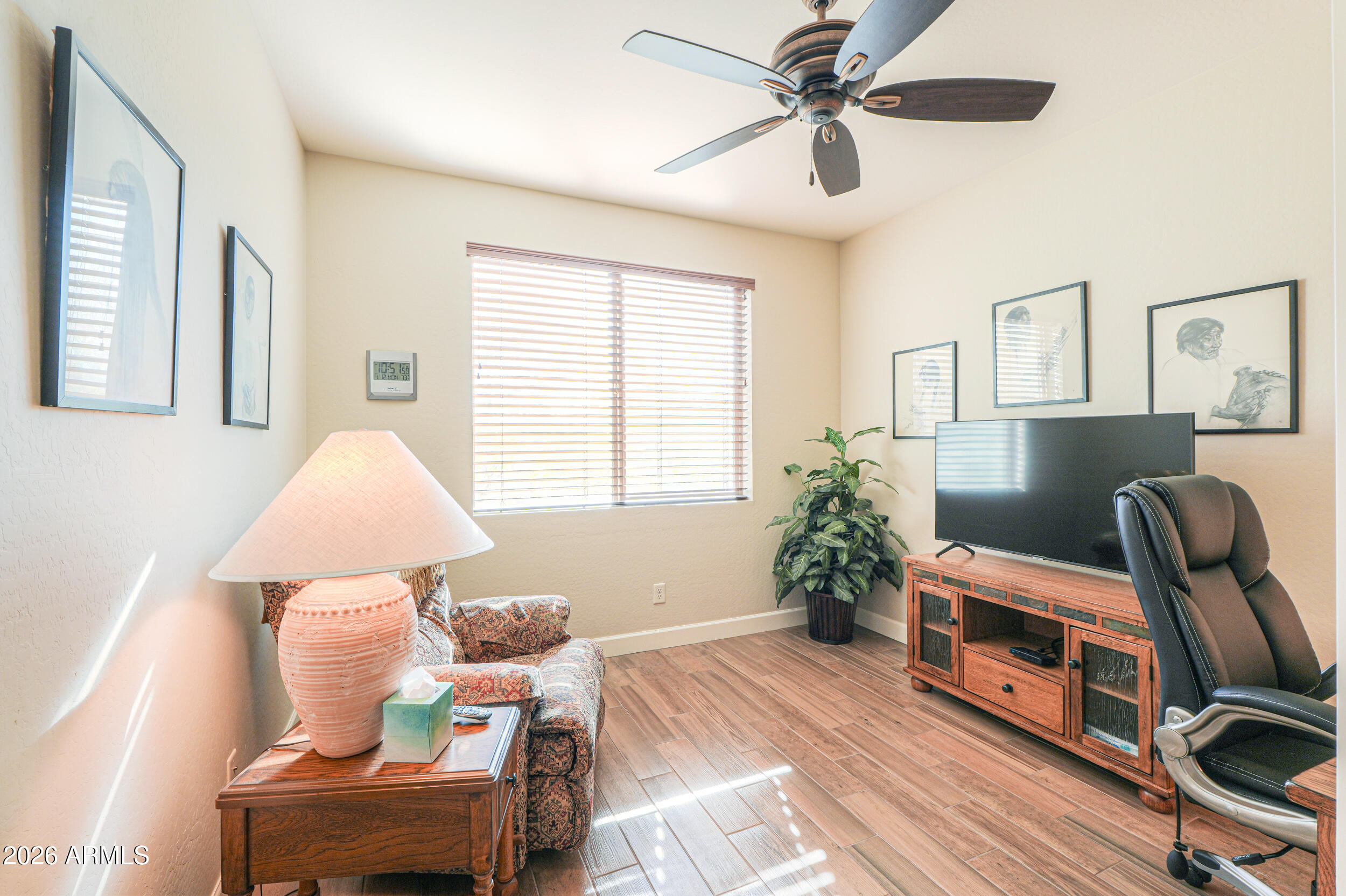 5048 North Scottsdale Road Eloy, AZ 85131 - Photo 30 of 53 a living room with furniture and a chandelier