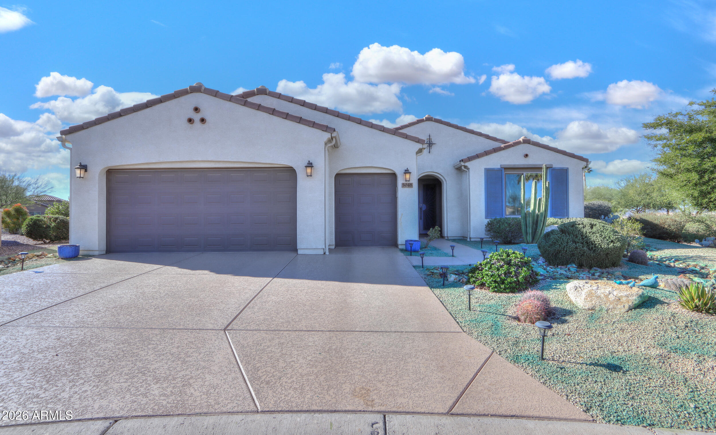 5048 North Scottsdale Road Eloy, AZ 85131 - Photo 3 of 53 a view of a house with a yard and potted plants