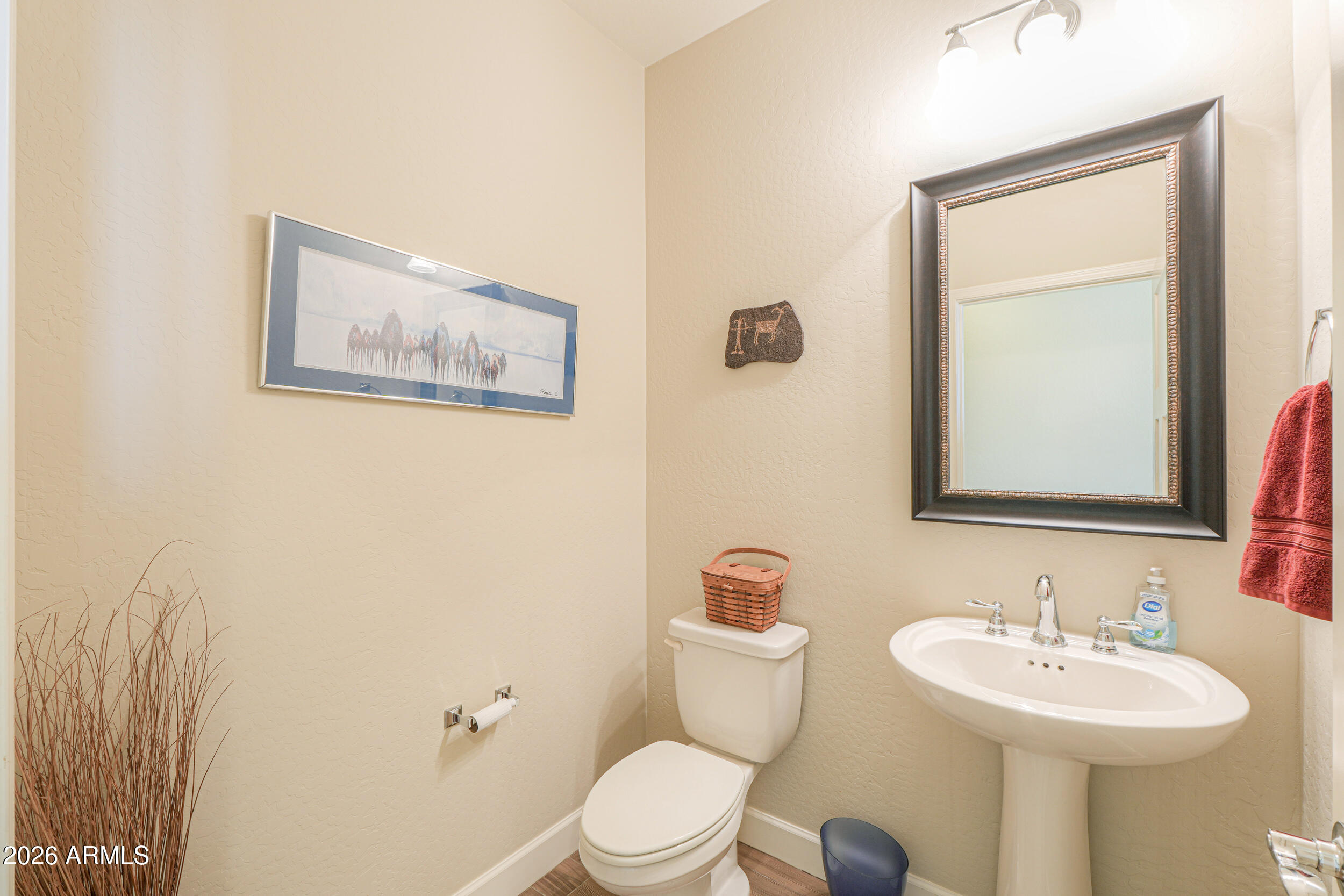 5048 North Scottsdale Road Eloy, AZ 85131 - Photo 32 of 53 a bathroom with a toilet a sink and mirror