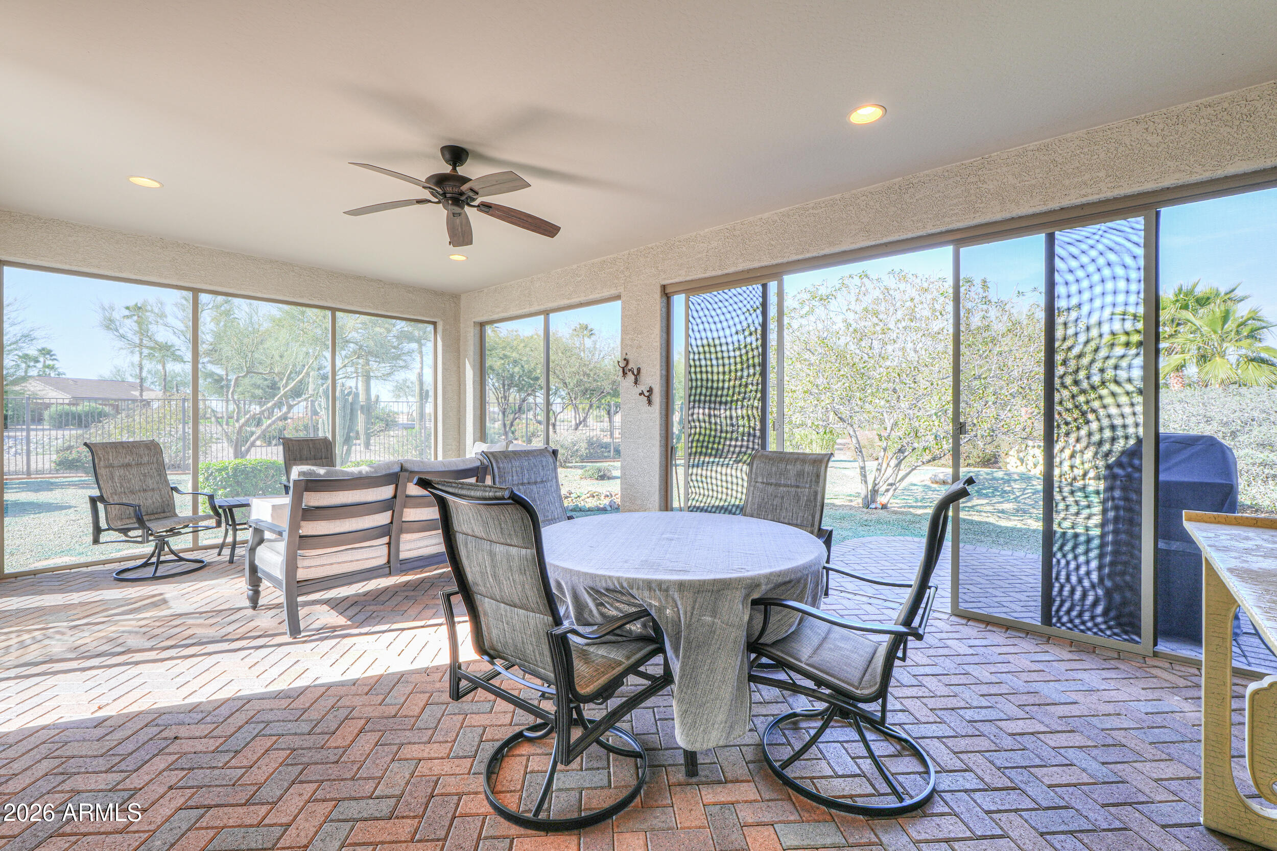 5048 North Scottsdale Road Eloy, AZ 85131 - Photo 36 of 53 a dining room with furniture a chandelier and wooden floor