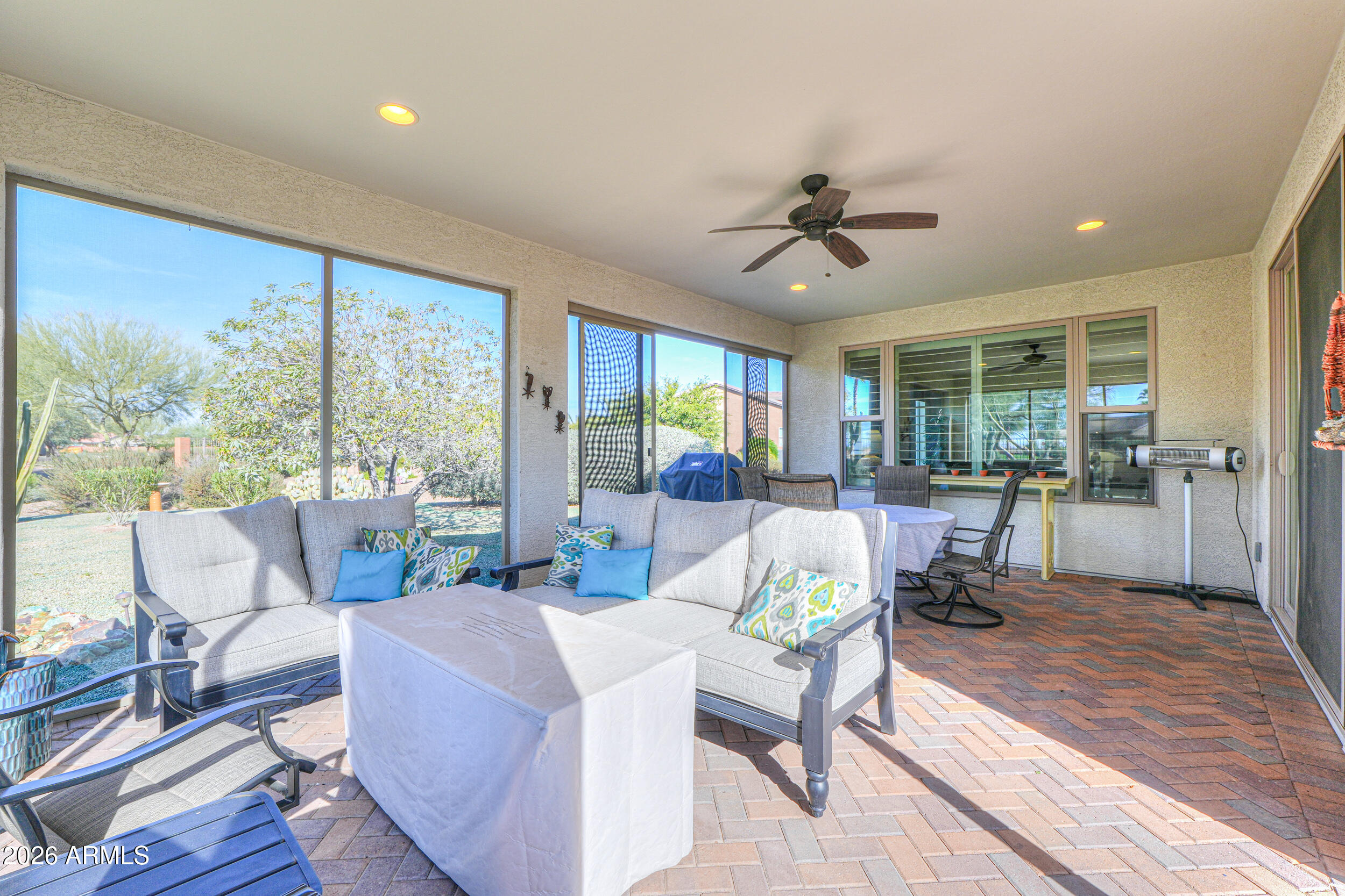 5048 North Scottsdale Road Eloy, AZ 85131 - Photo 38 of 53 a living room with furniture and a floor to ceiling window