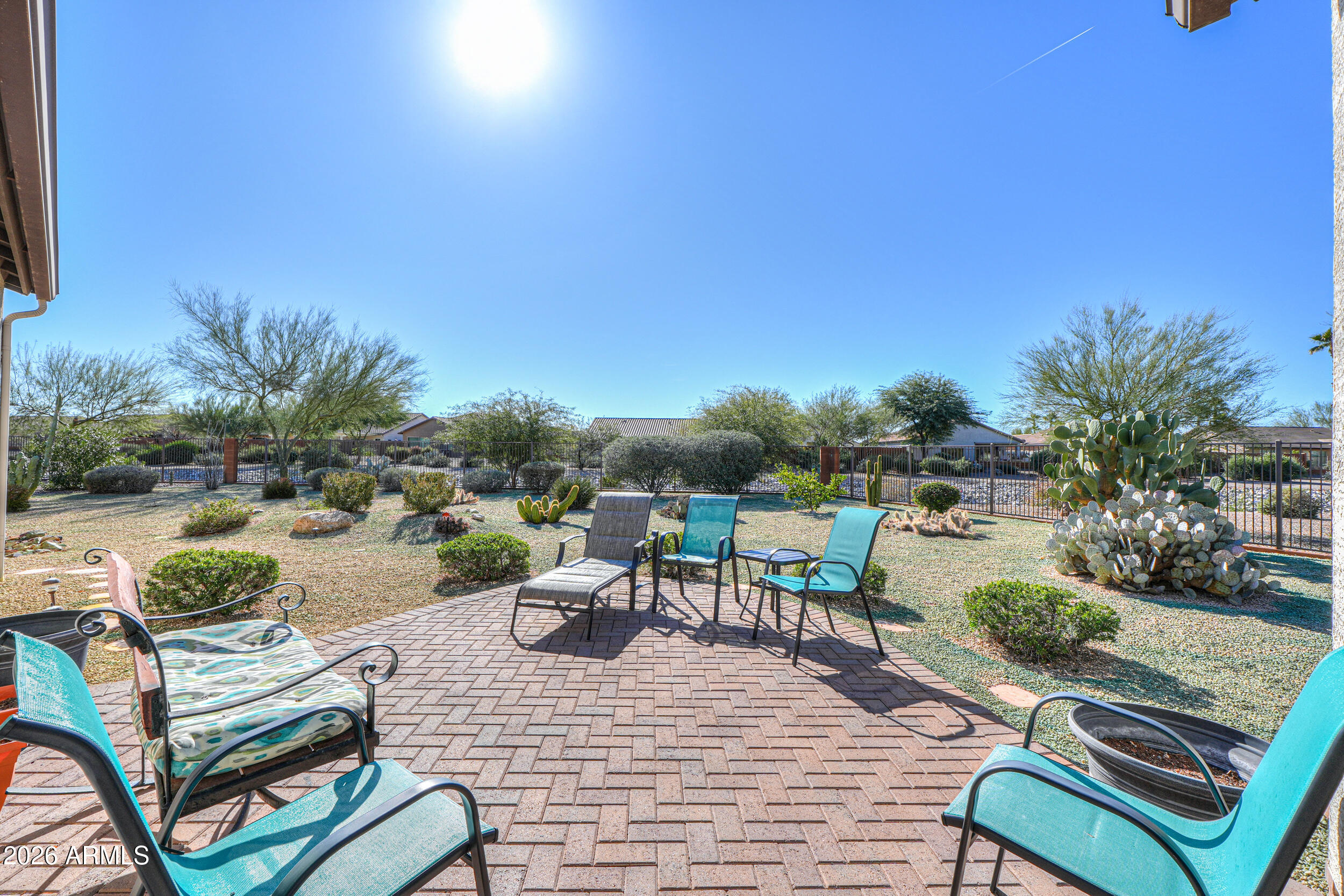 5048 North Scottsdale Road Eloy, AZ 85131 - Photo 39 of 53 a view of a patio with dining table and chairs potted plants with wooden floor