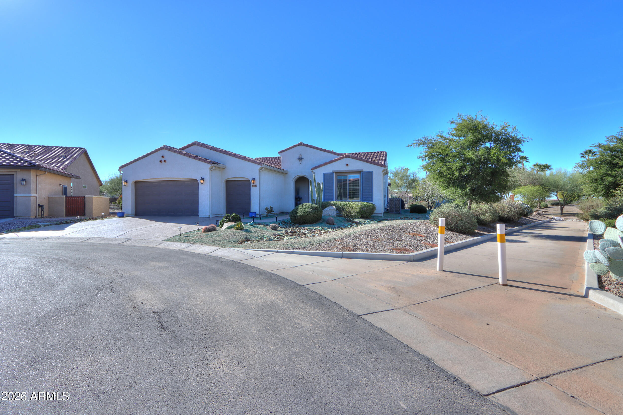 5048 North Scottsdale Road Eloy, AZ 85131 - Photo 5 of 53 a front view of a house with a yard and a garage