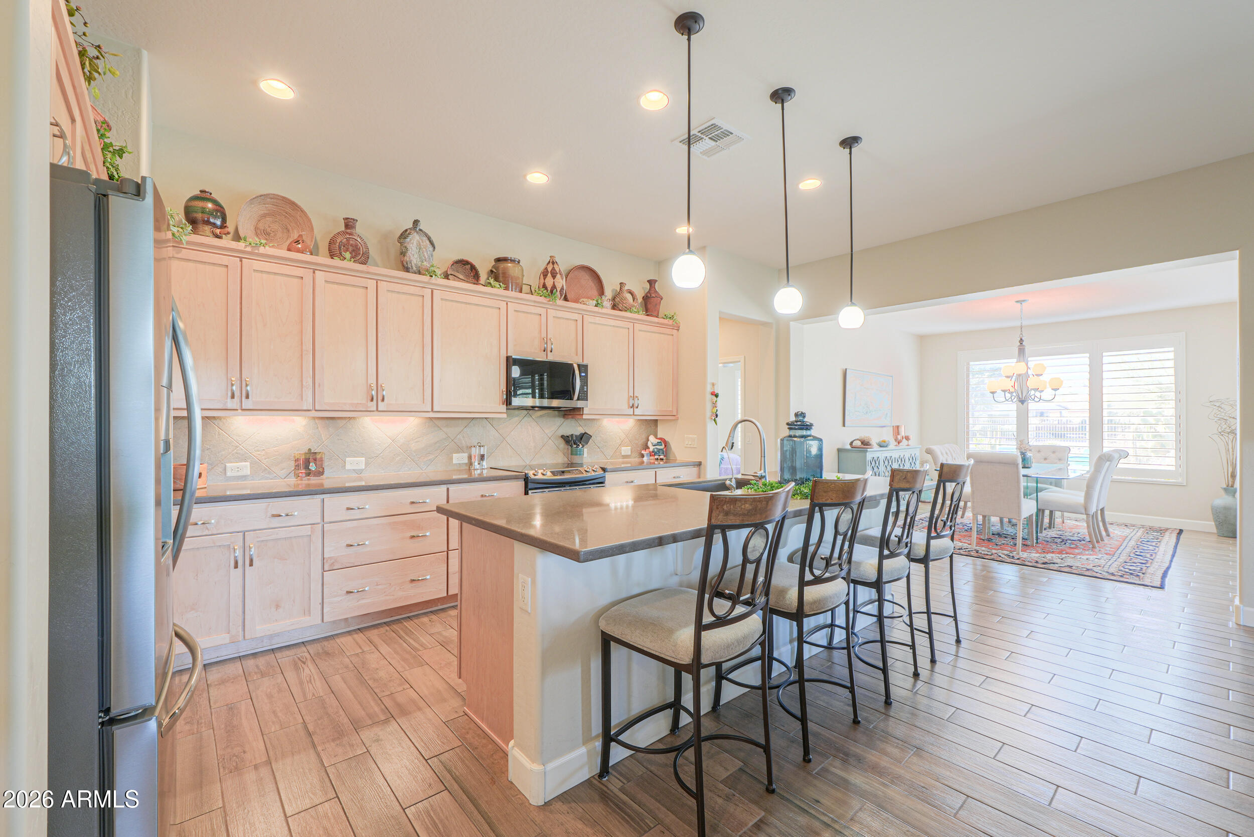 5048 North Scottsdale Road Eloy, AZ 85131 - Photo 9 of 53 a large kitchen with lots of counter space a sink appliances and dining table