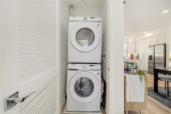a view of a hallway with washer and dryer