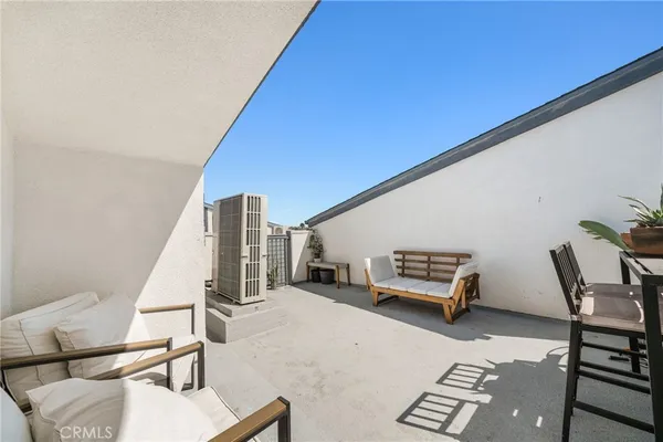 a living room with furniture and a stairs