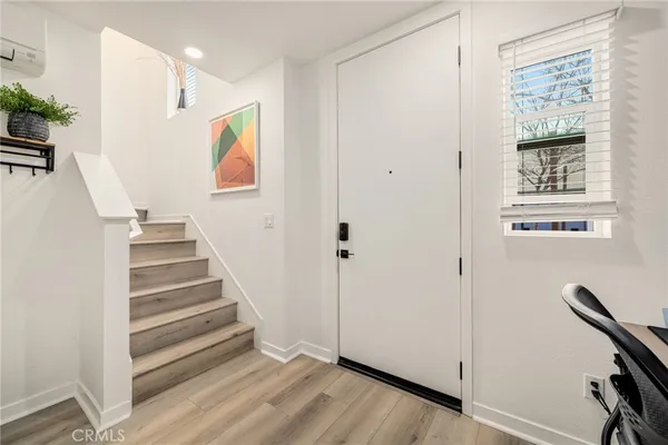 a view of entryway with wooden floor