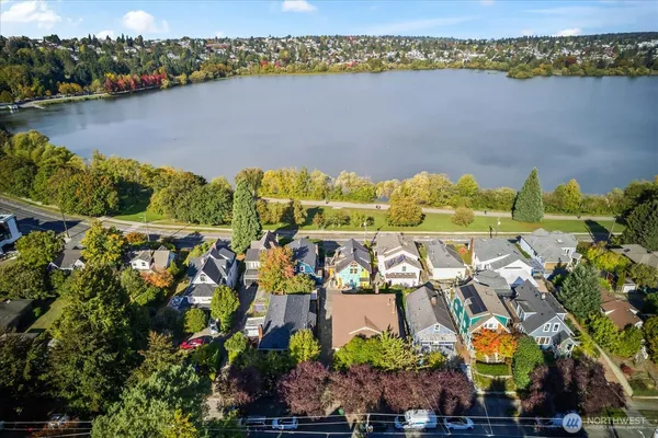 an aerial view of houses with yard