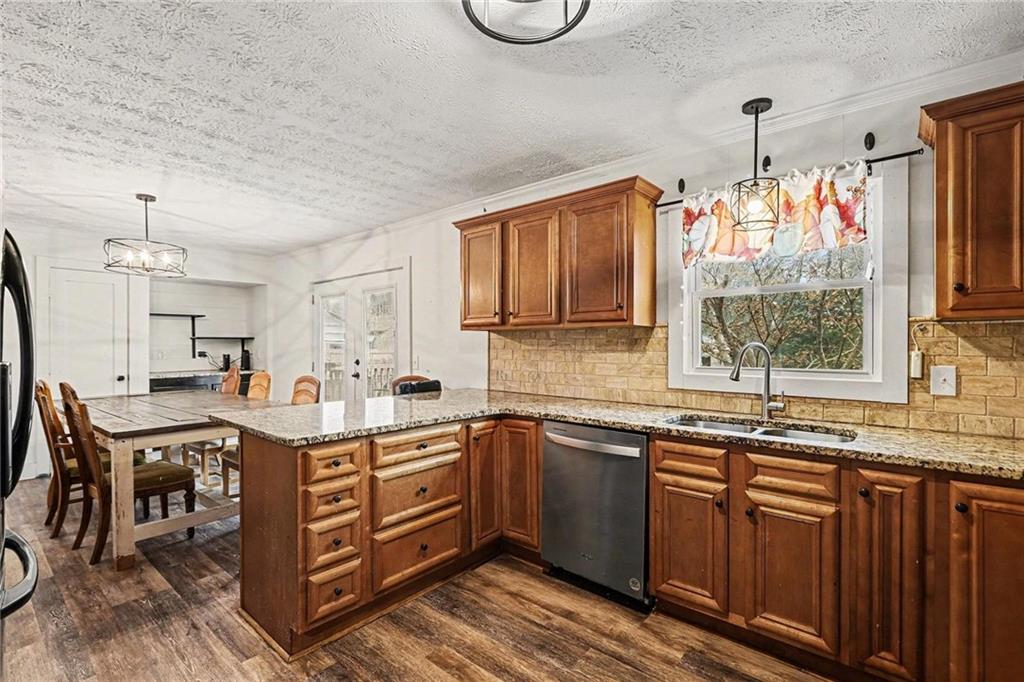 221 Rome Street Temple, GA 30179 - Photo 16 of 30 a kitchen with lots of counter top space and dining table