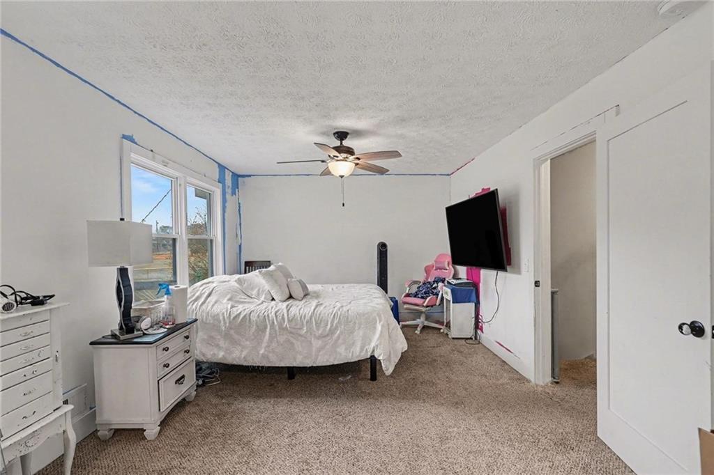 221 Rome Street Temple, GA 30179 - Photo 20 of 30 a living room with a flat screen tv and a couch