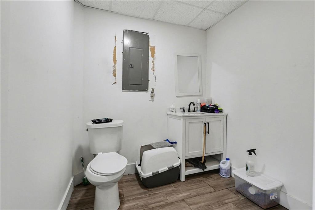 221 Rome Street Temple, GA 30179 - Photo 24 of 30 a bathroom with a toilet sink and mirror