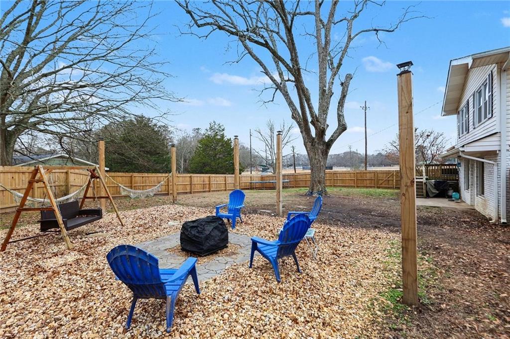 221 Rome Street Temple, GA 30179 - Photo 30 of 30 a view of a chairs and table in backyard