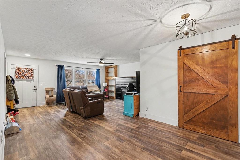 221 Rome Street Temple, GA 30179 - Photo 6 of 30 a living room with furniture and a flat screen tv