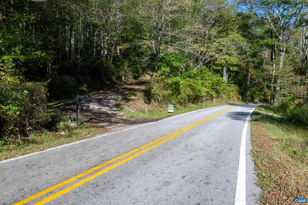 a view of a pool with a yard