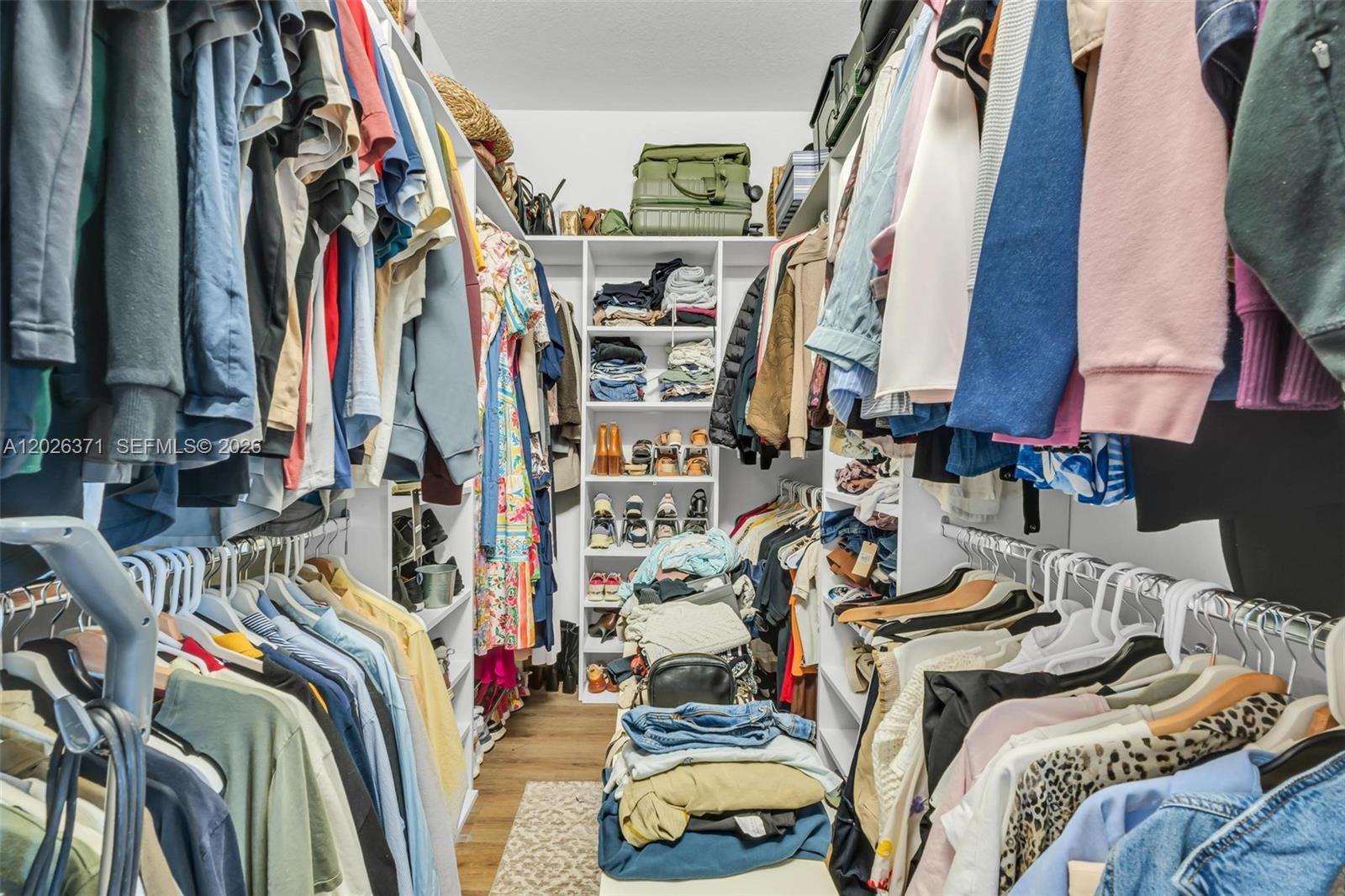 2273 Northwest 131st Circle Miami, FL 33167 - Photo 27 of 46 a view of walk in closet with clothes