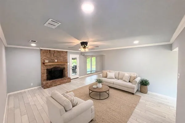 a living room with furniture and a fireplace