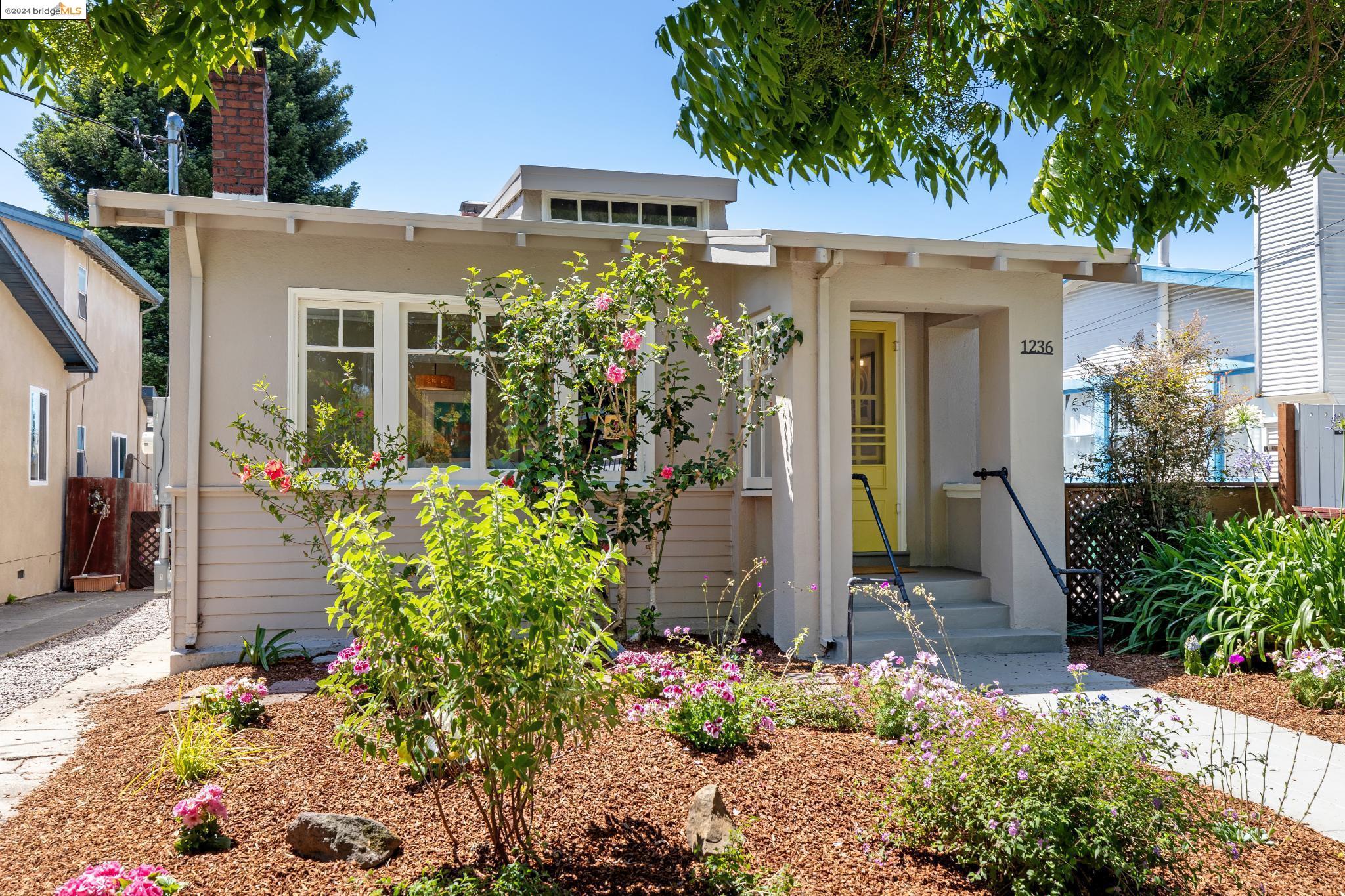 1236 Ordway Street Berkeley, CA 94706 - Photo 1 of 1 front view of a house with a yard